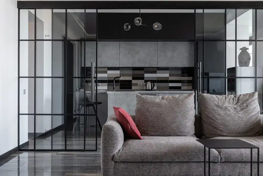 A large stained glass room divider in a modern living space
