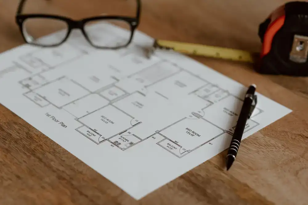 Drafting table with lead line diagrams and glass samples