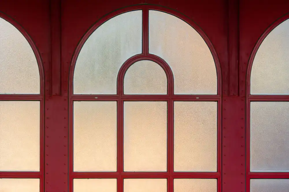 Large historic arched window undergoing stabilization